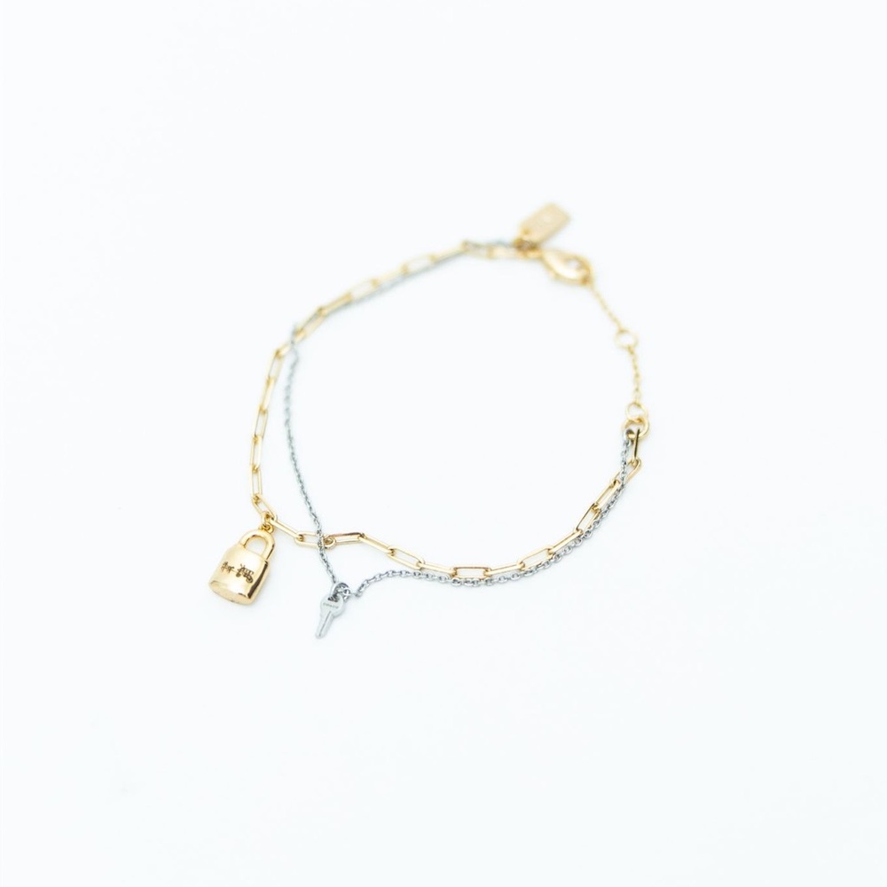 Coach Two-Tone Gold and Silver Bracelet with Lock and Key Charms